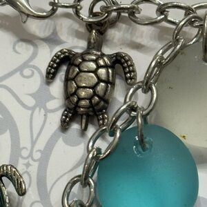 Silver Turtle Charm Bracelet with Blue, green and clear sea glass type Beads